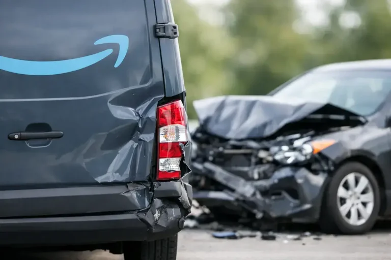 Damaged van and car after collision