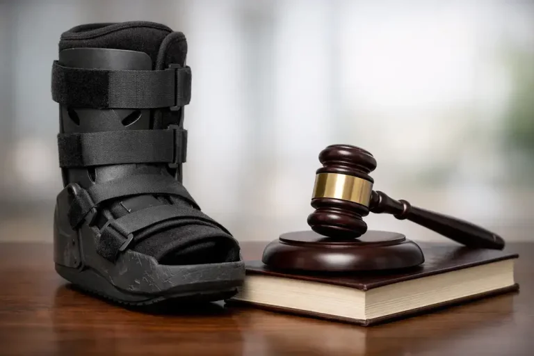 Medical boot beside gavel and law book