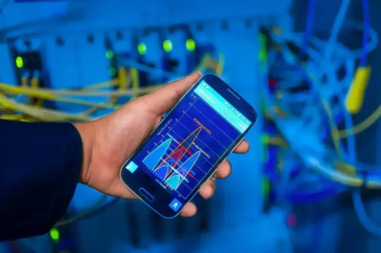 Phone showing network graph in server room