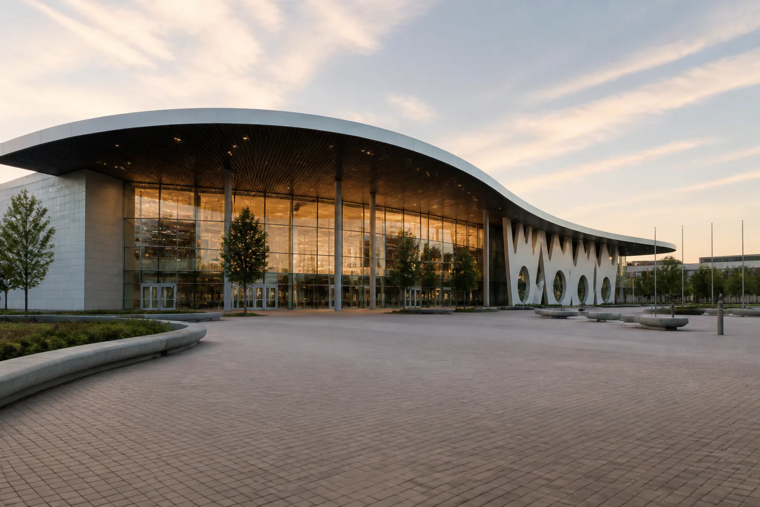 Modern glass building at sunset